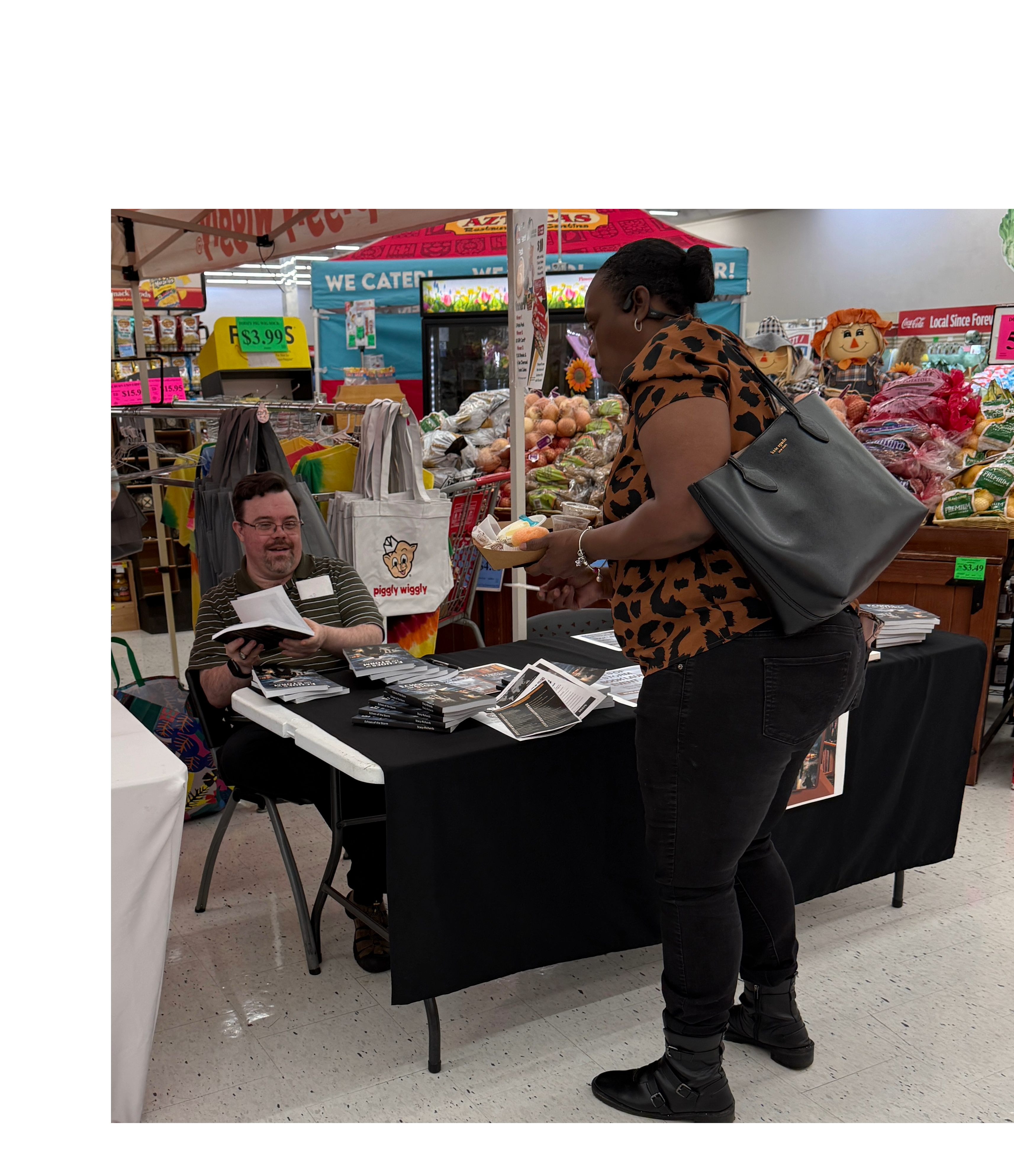 A reader receiving a signed copy of Echoes of the Storm